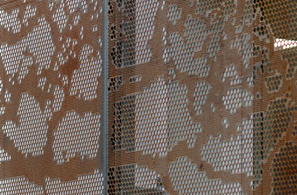 The gabels of the house have been covered with perforated metal sheets.