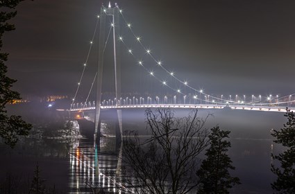 The two main cables consist of 12,000 parallel wires, and the span between the pylons is 1,210 meters.
