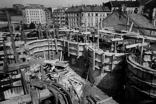 An old black and white photo of a construction site. 